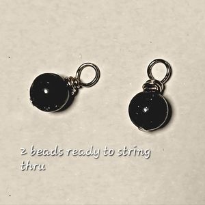 Two lapis lazuli pendants to string thru with your own necklace of your choice.